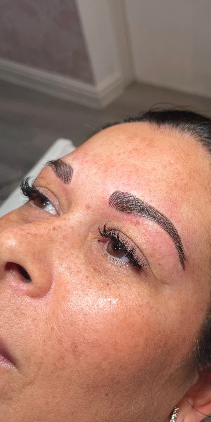 Bold, freshly applied semi-permanent eyebrows