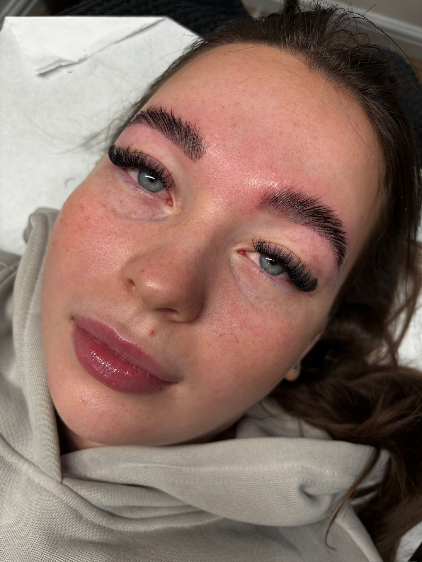 Lash extensions paired with shaped brows