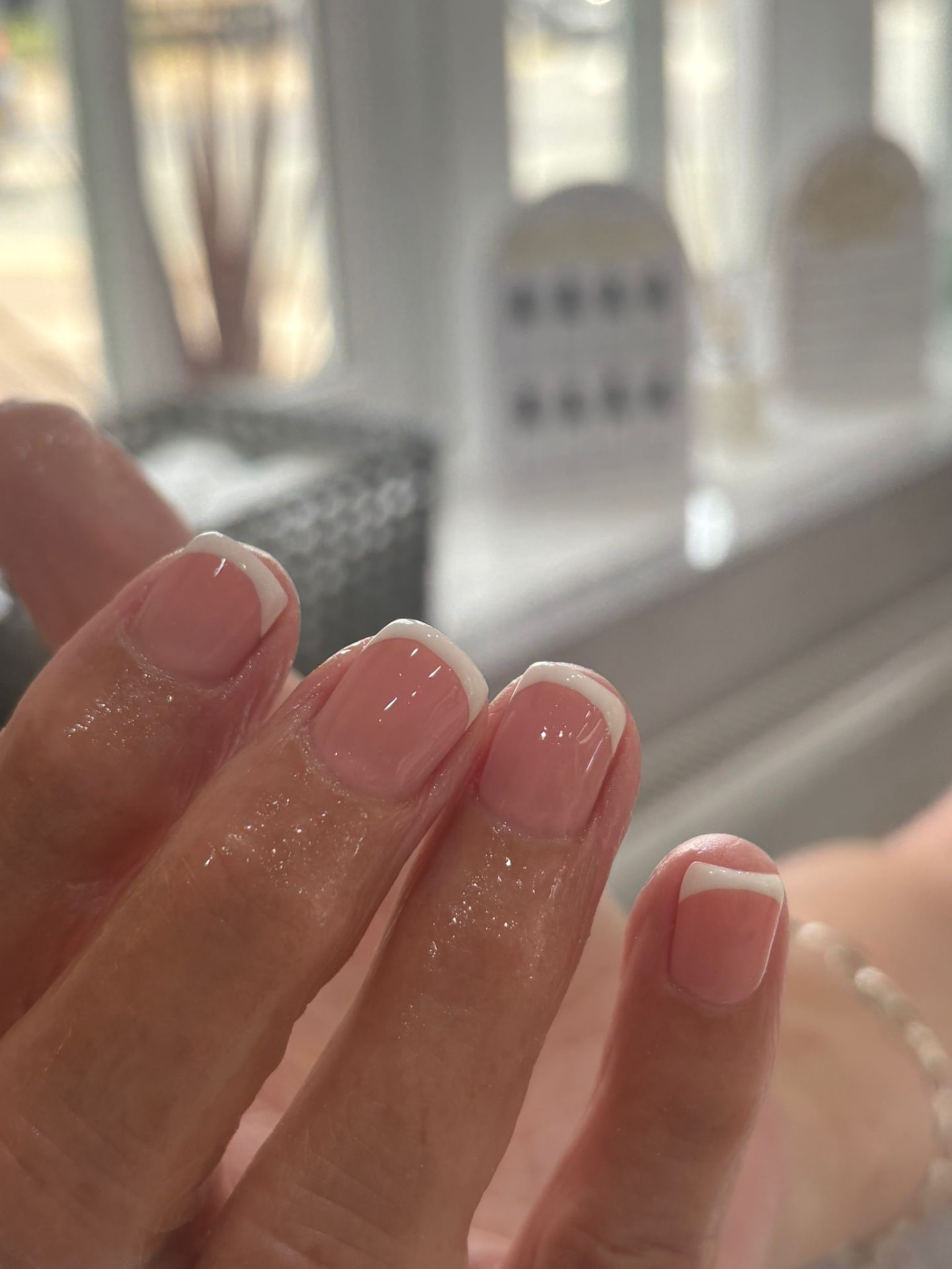 Classic white French manicure on short square nails