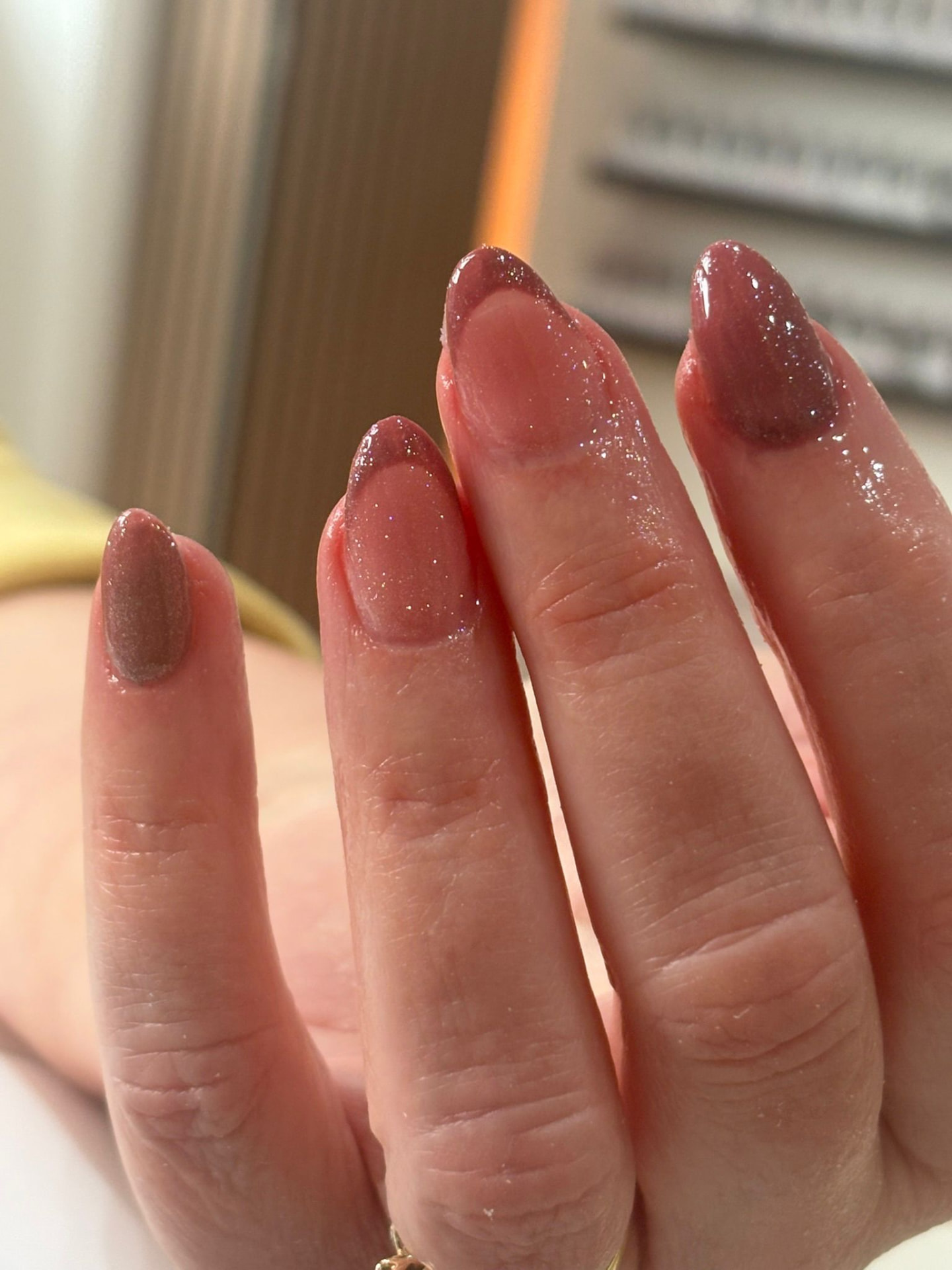 Shimmery mauve French manicure with glitter base