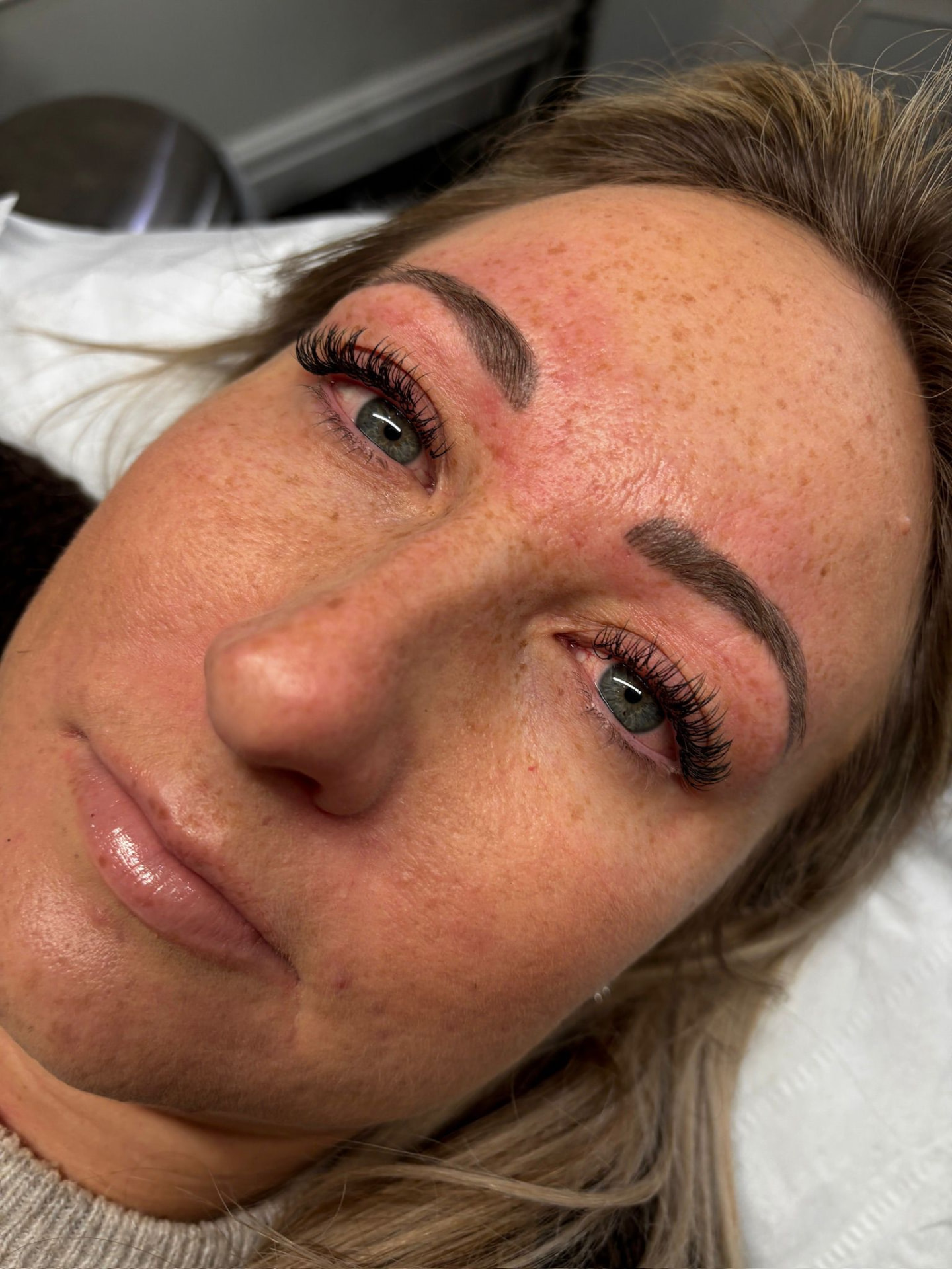 Fresh eyelash extensions on a client with blue eyes